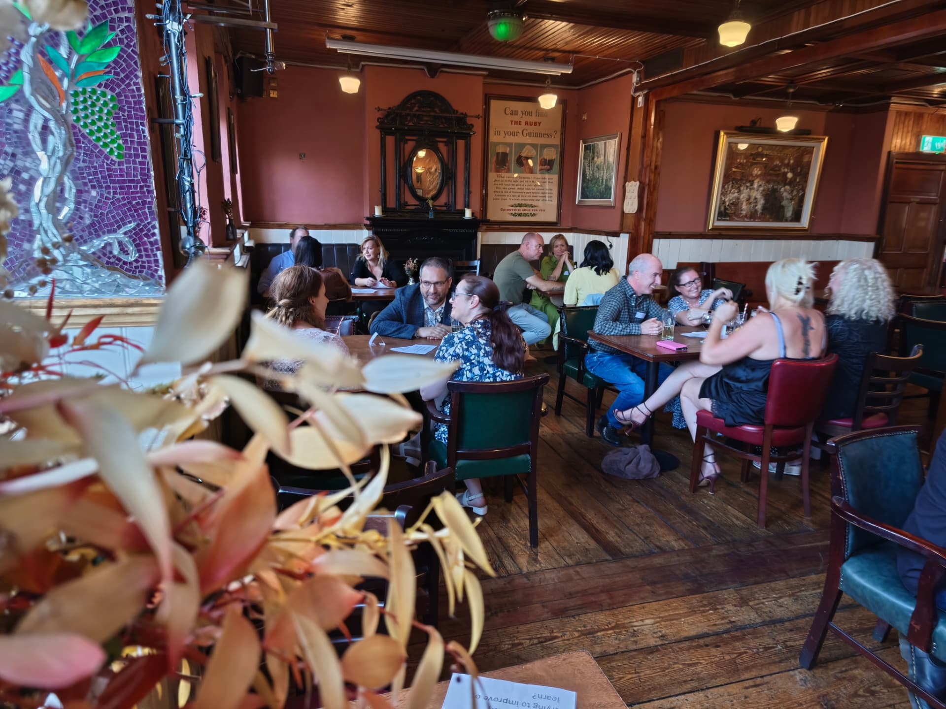 Guests enjoying conversation at a Love Éire pub event