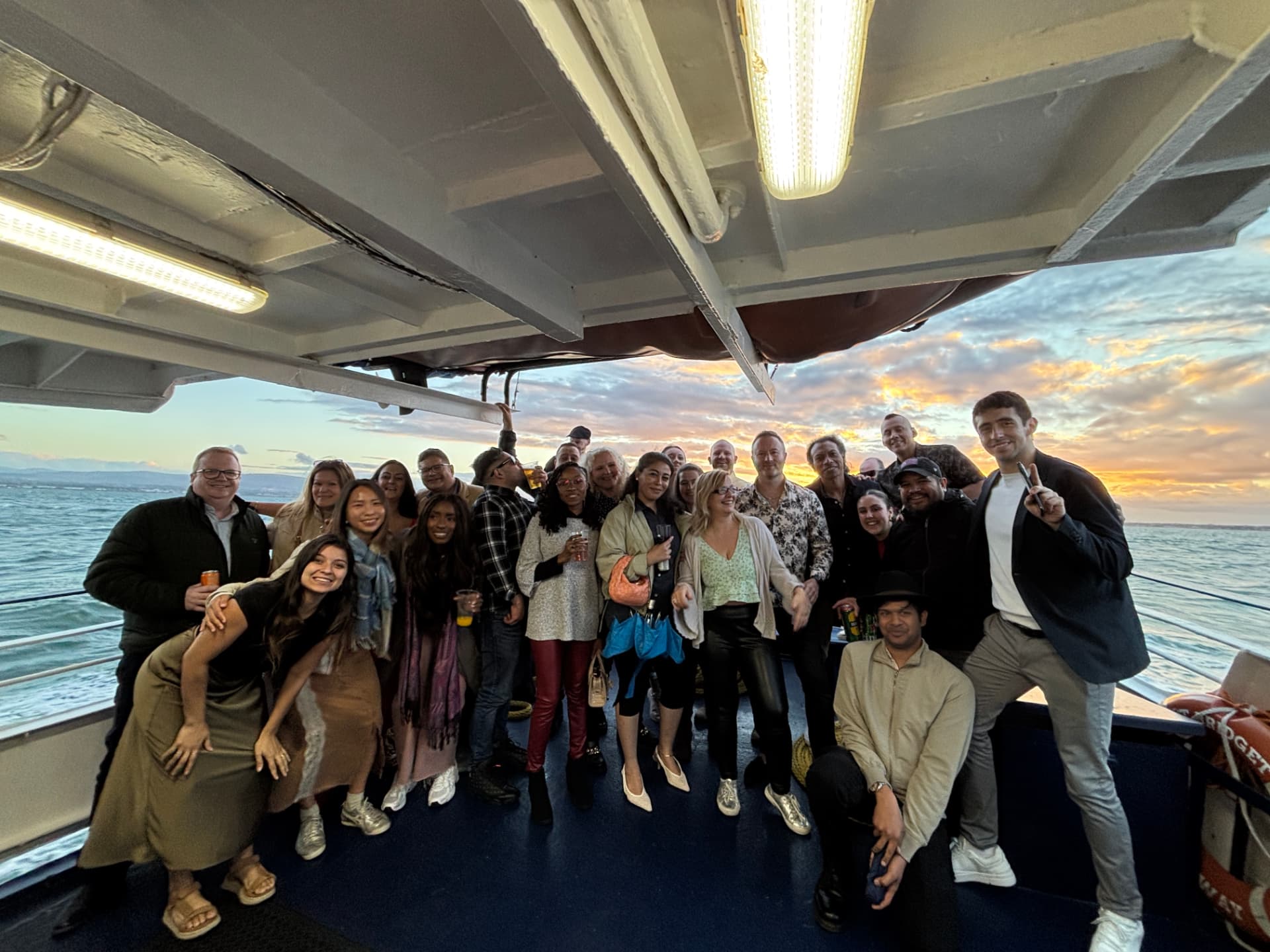 The Love Éire group together on deck at sunset